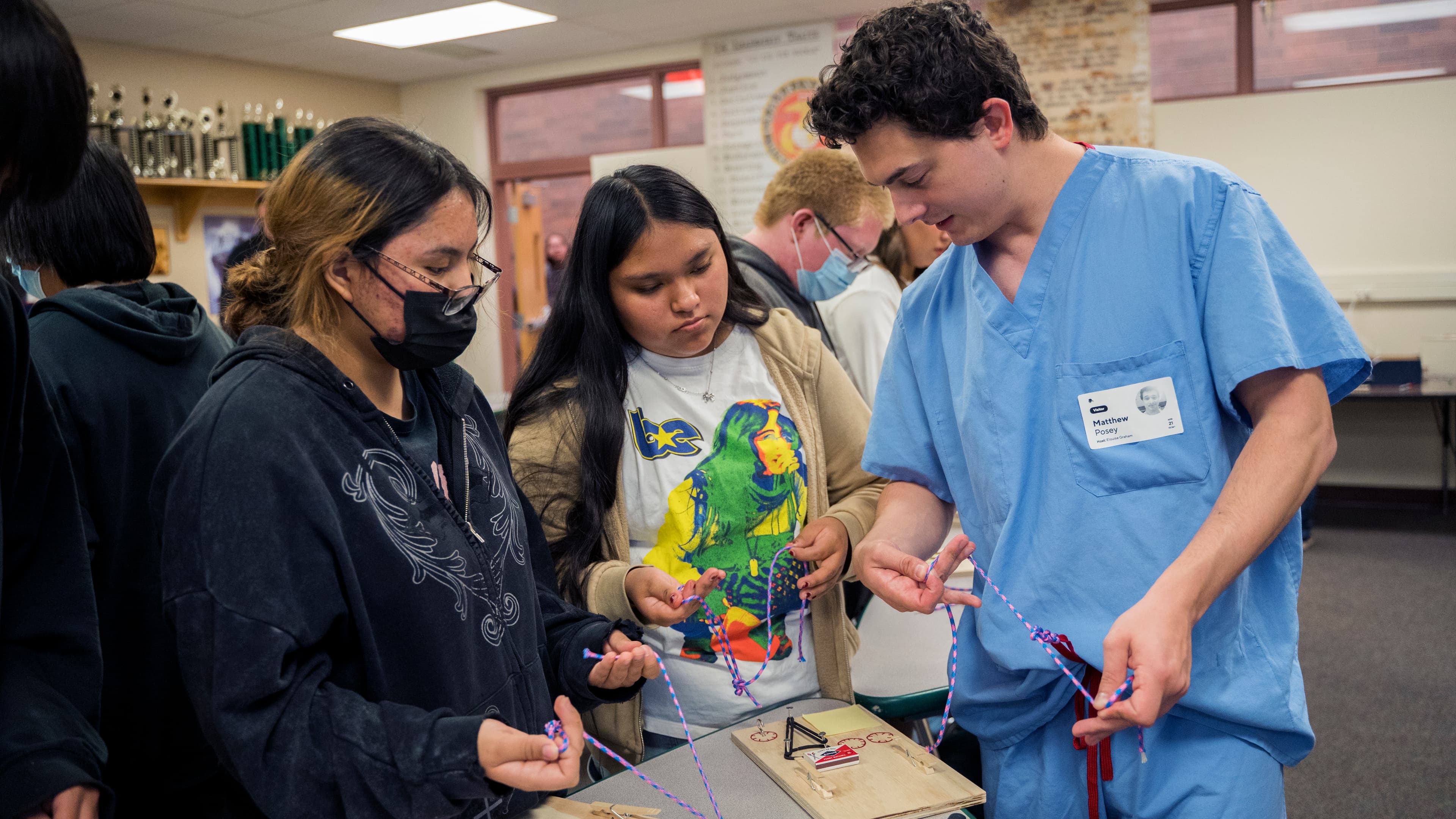Instructor demonstrating knot tying techniques