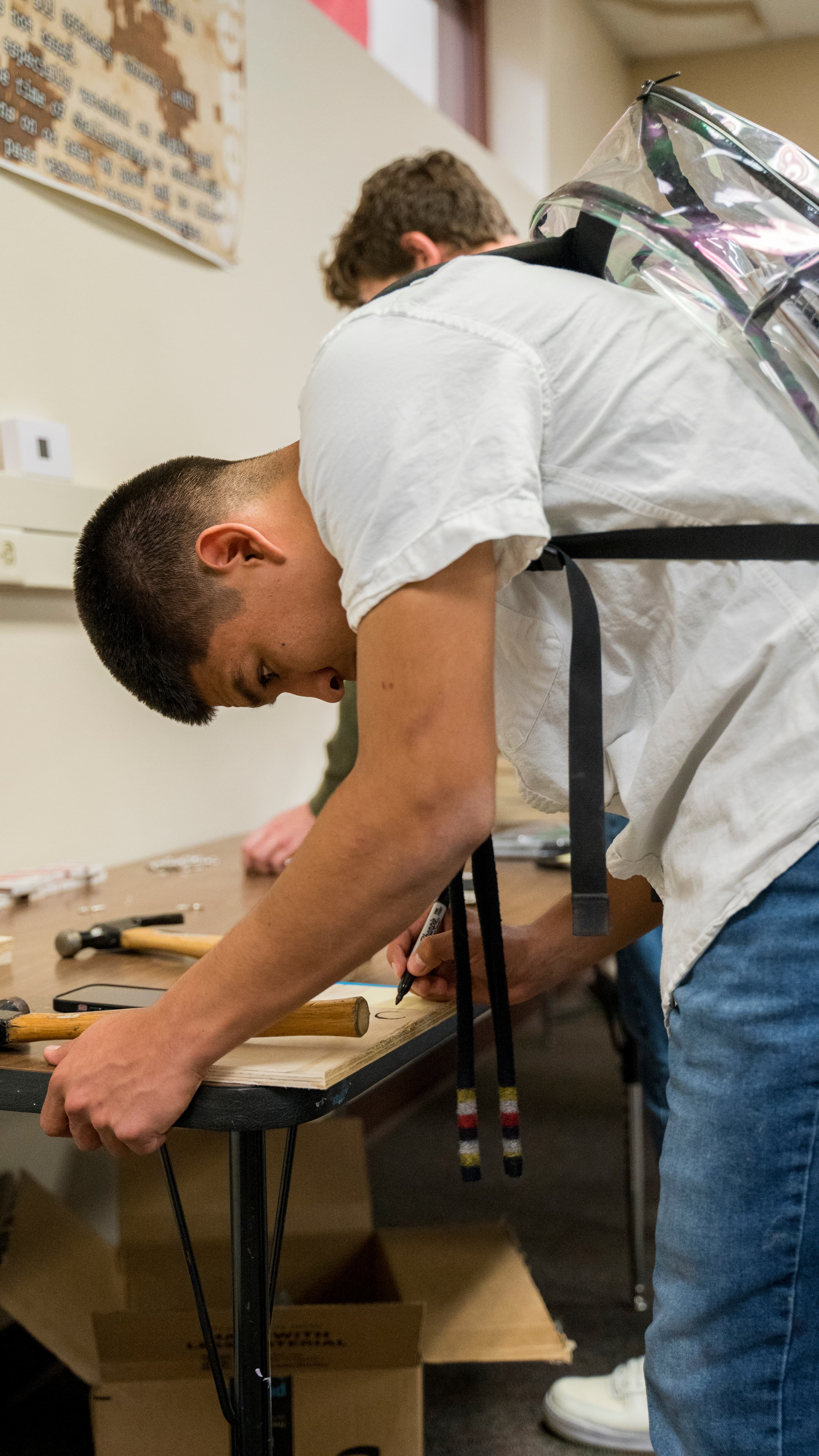 Students building suturing kits together at a table