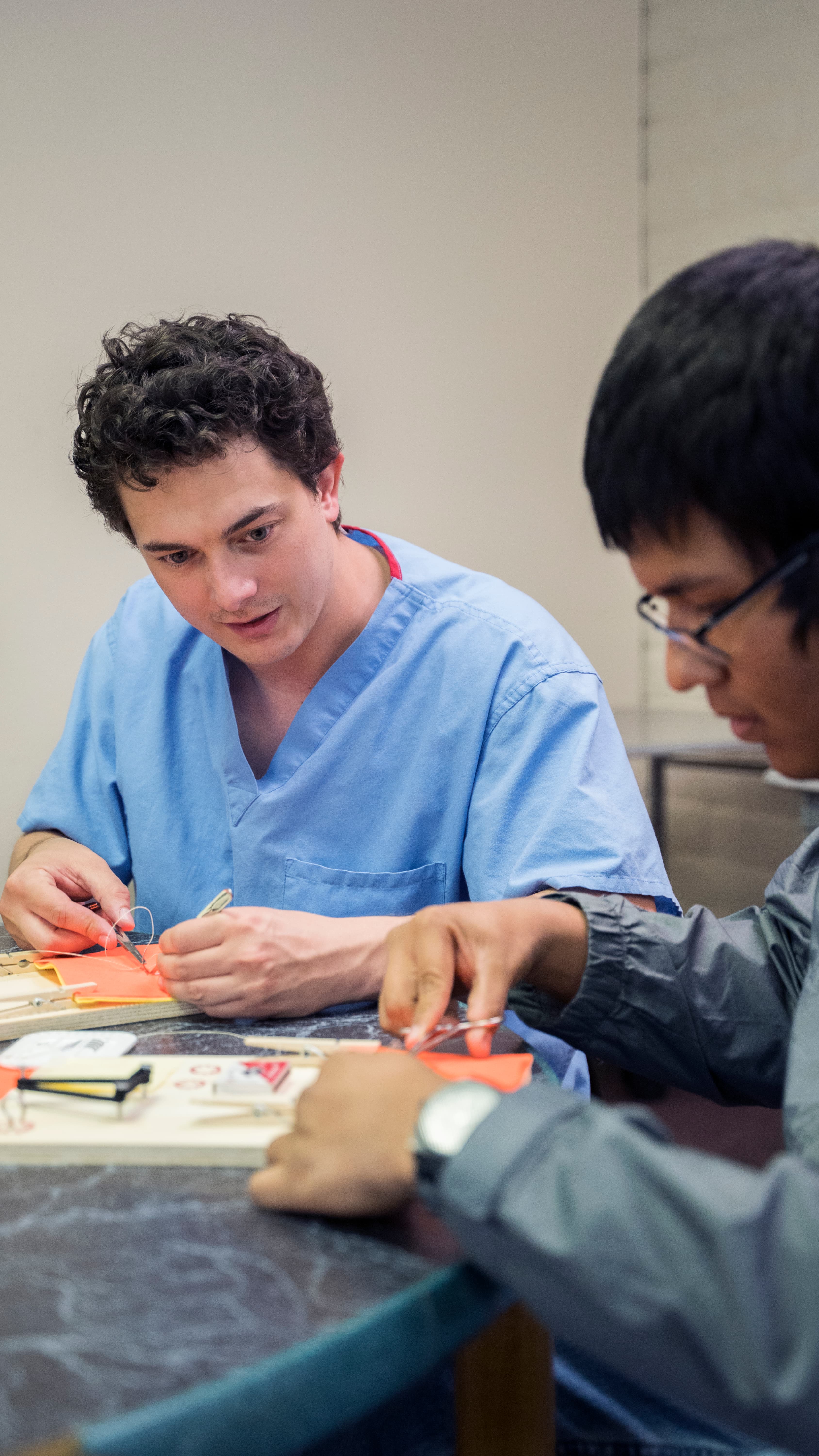 Mentor Matt demonstrating suturing technique
