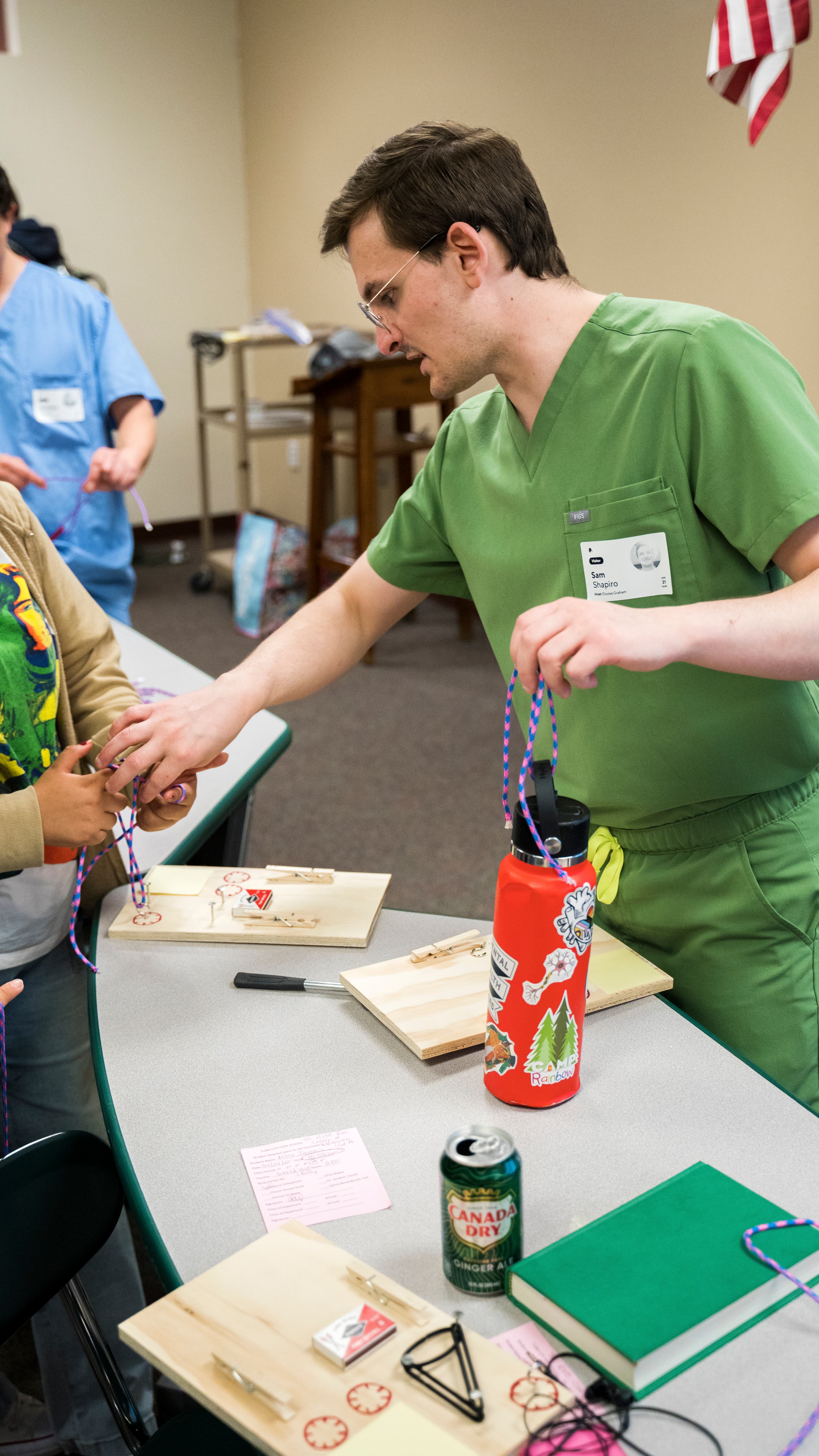 Sam guiding students through knot tying practice