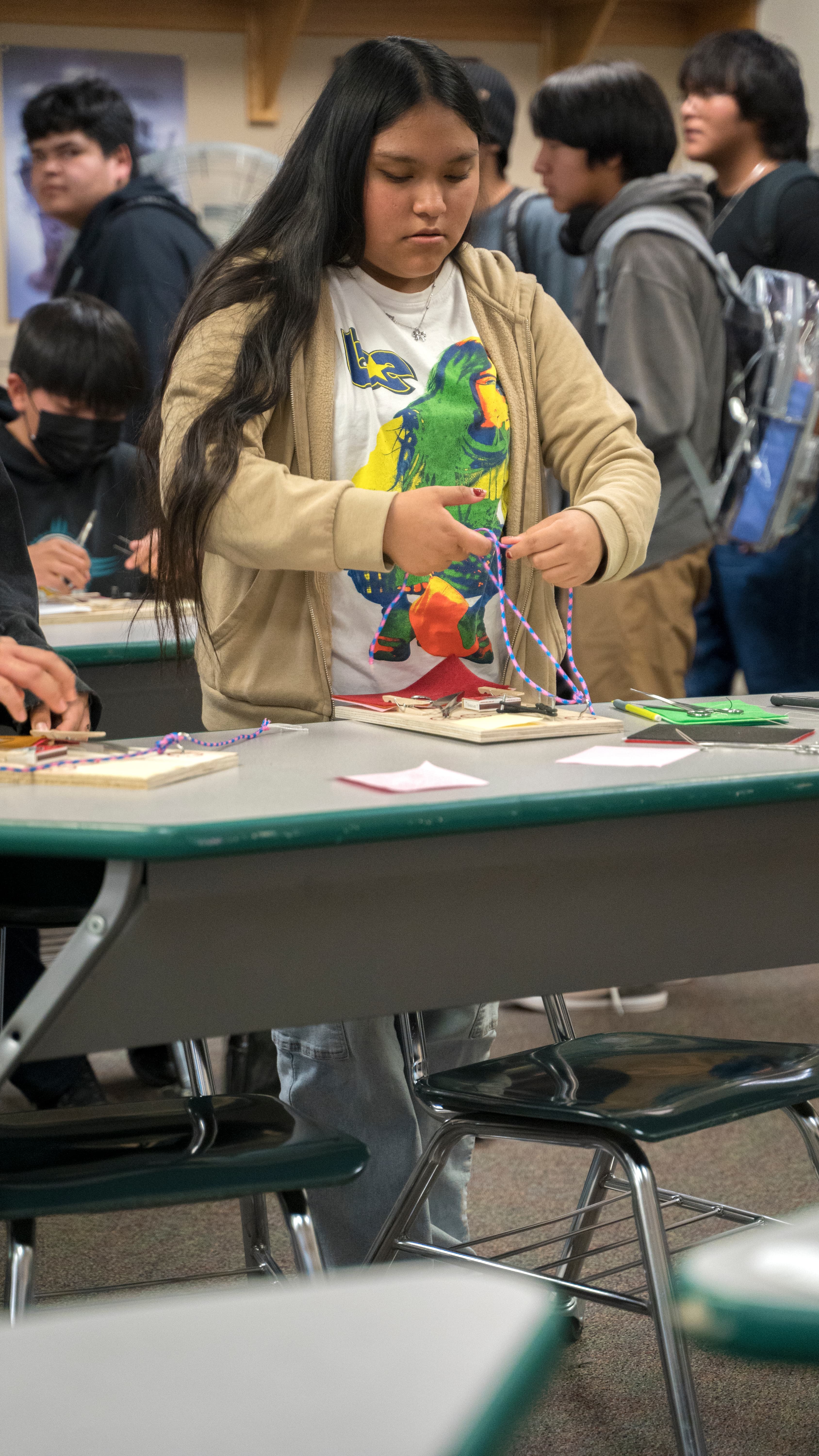 Student practicing surgical knots with a kit