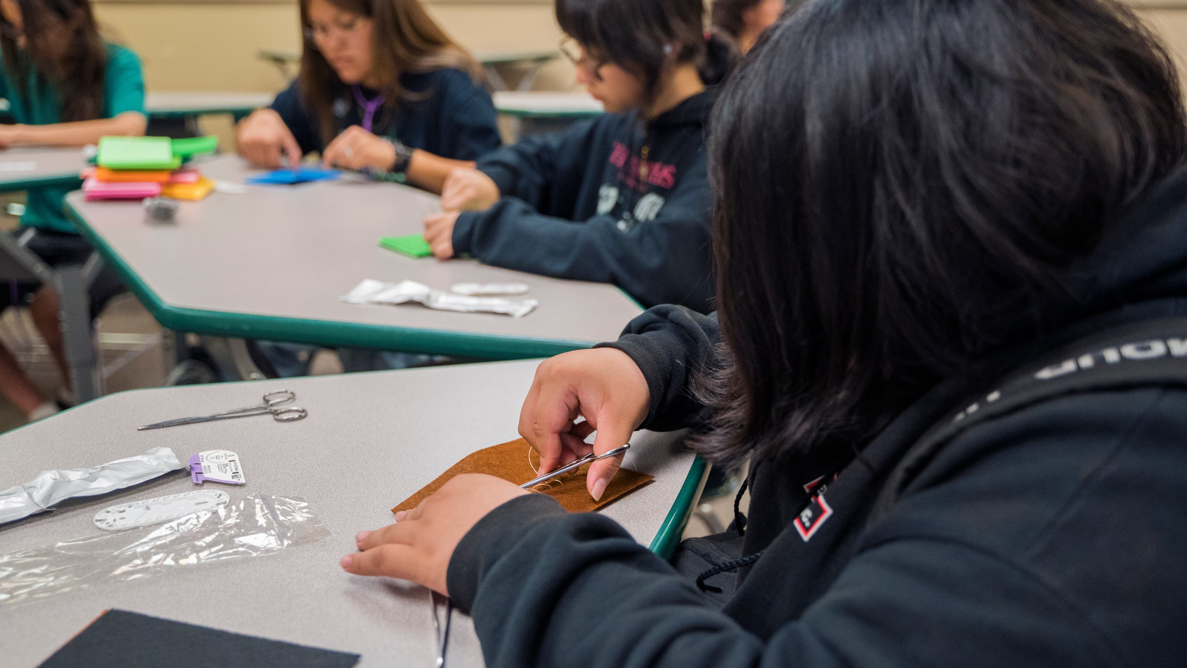 Student using a needle driver during practice